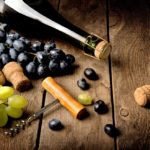 Grape and wine on a wooden table.When: 14 Oct 2015