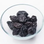 lot of prunes in transparent glass bowl.When: 25 Oct 2013