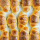 High angle closeup shot of delicious small croissants taken out from the oven