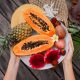 Woman’s hands with big plate of fresh exotic fruits.