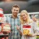 Cheerful couple buying food for christmas